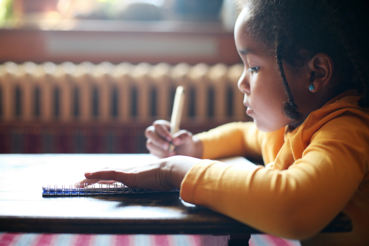 Girl Writing in Notebook